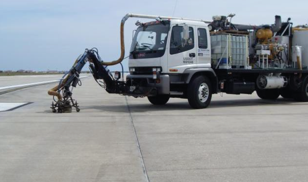 Runway Rubber Removal Contract # F38604-T-0455